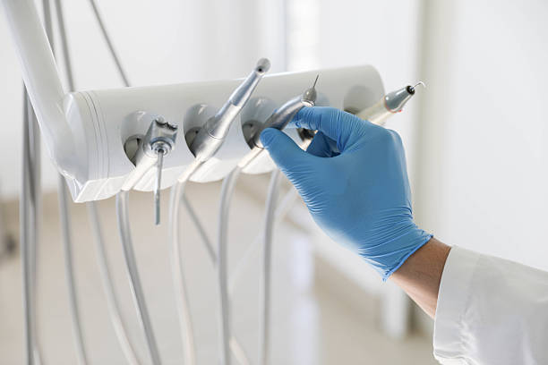 Professional Tooth Extraction technician working in Alexandria, AL